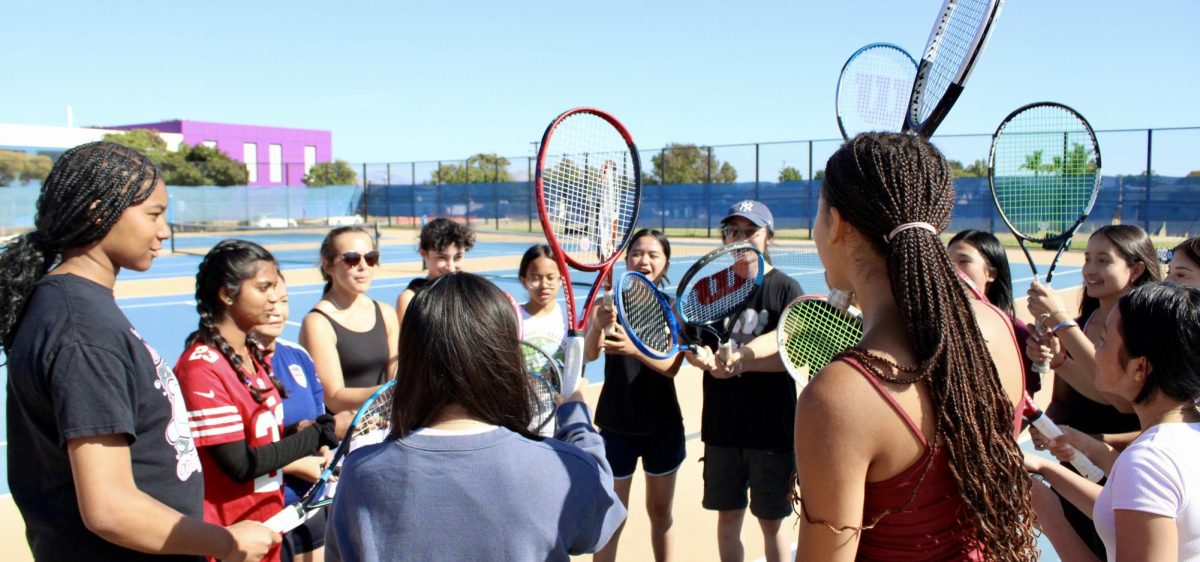 Girls tennis cheers before their match against Bishop O’Dowd High School.