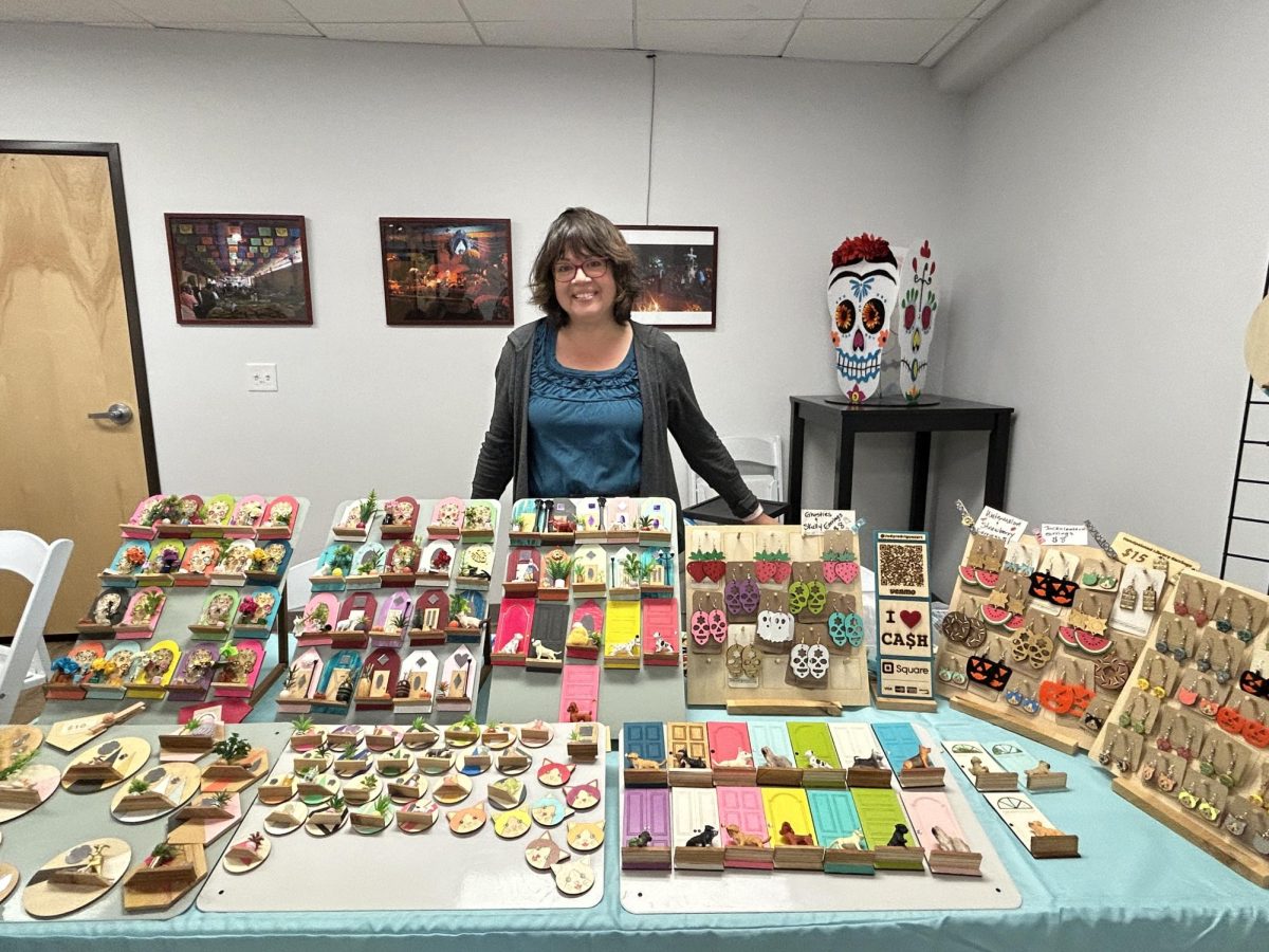 Judy Rodriguez in front of her miniature creations.