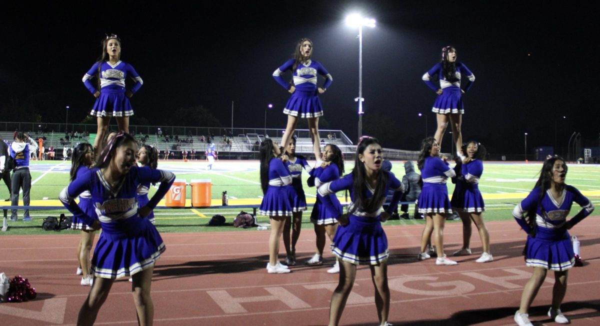 Mt. Eden cheerleaders cheering at Mt. Eden’s game against San Lorenzo High School.