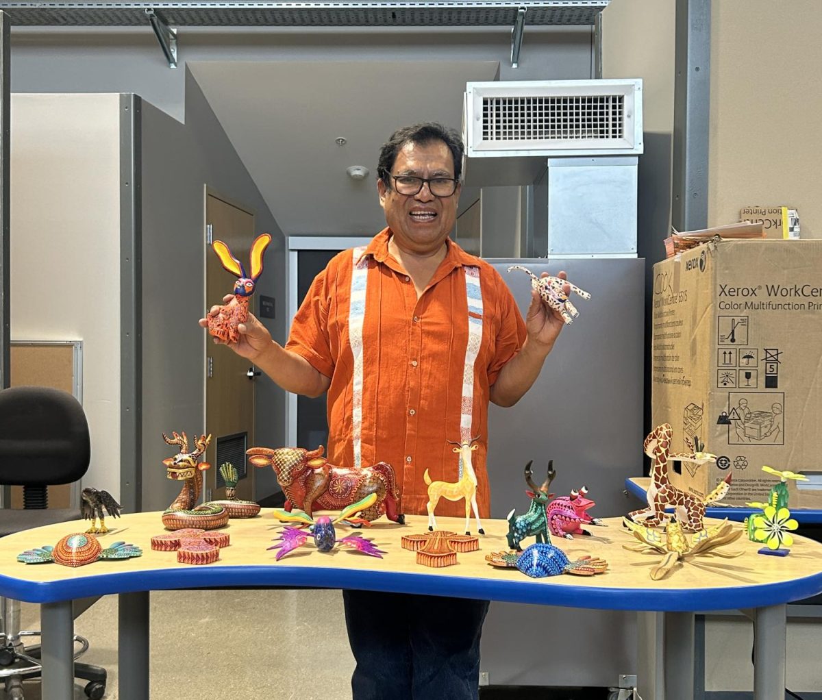 Alebrije artist Jesús Sosa Calvo displays his pieces at the STEAM Makerspace in a demonstration for Mt. Eden art and Spanish students.