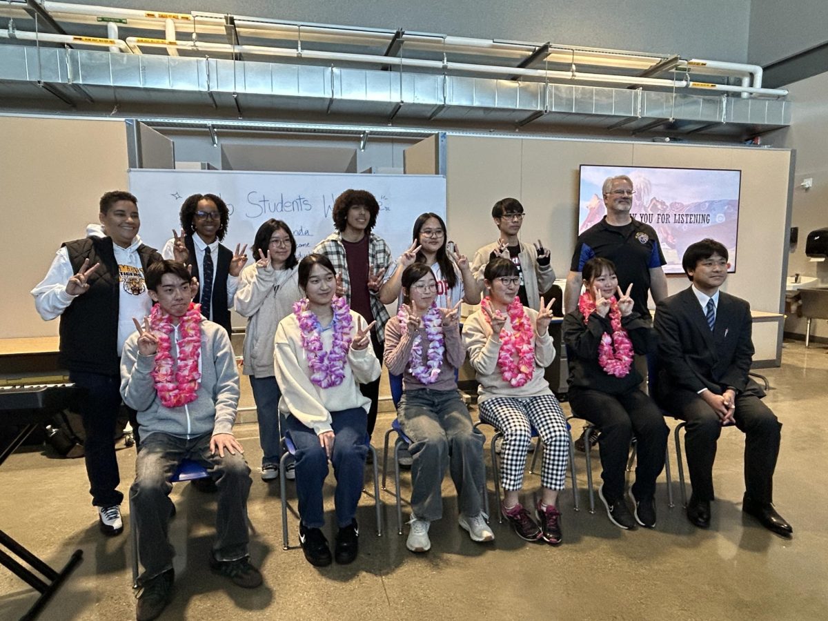 Sado High School students and Mt. Eden’s Japanese Club pose for a photo alongside Principal Dr. Walton.